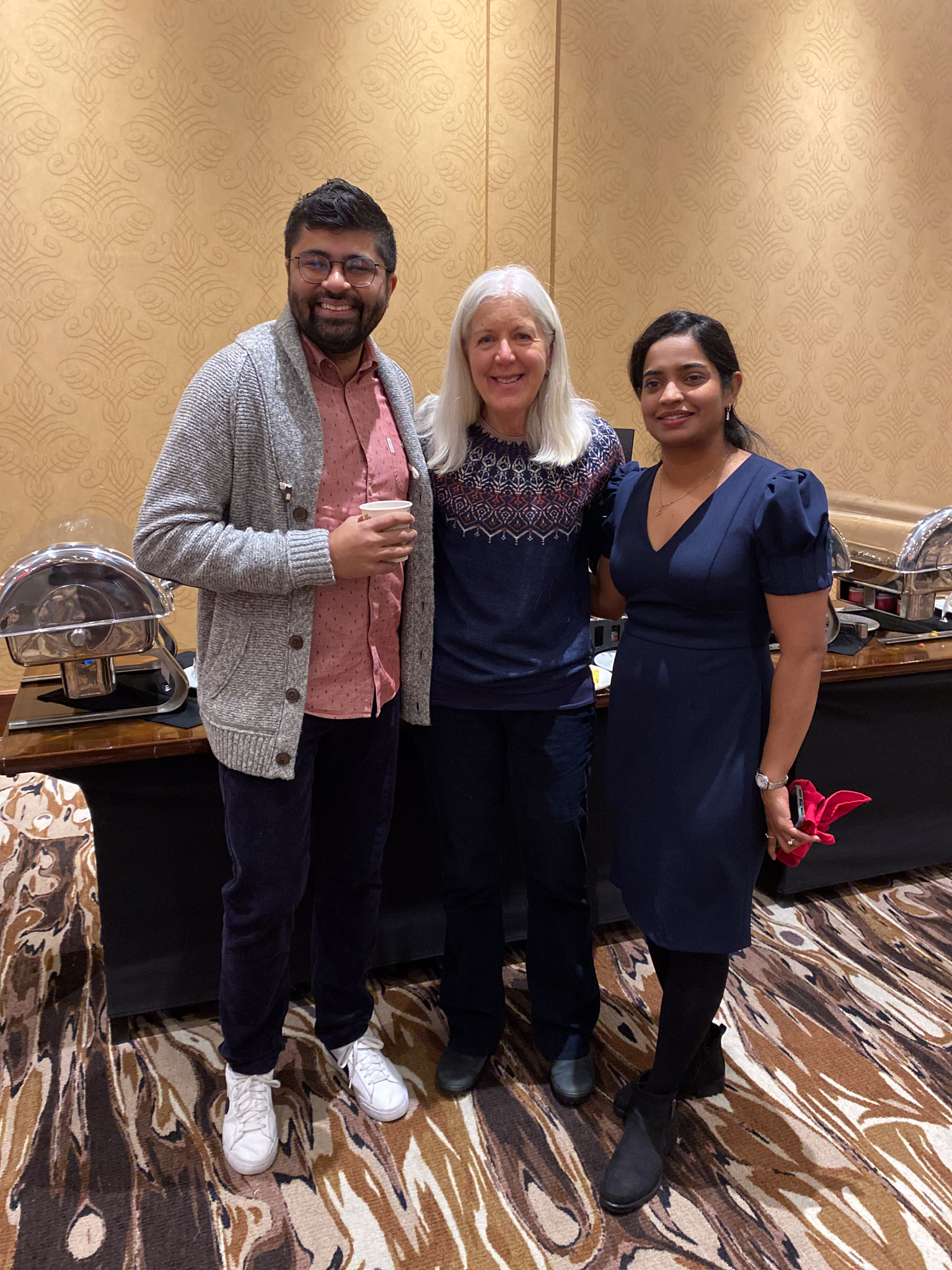 Zain Velji poses with YMCA Calgary board/staff