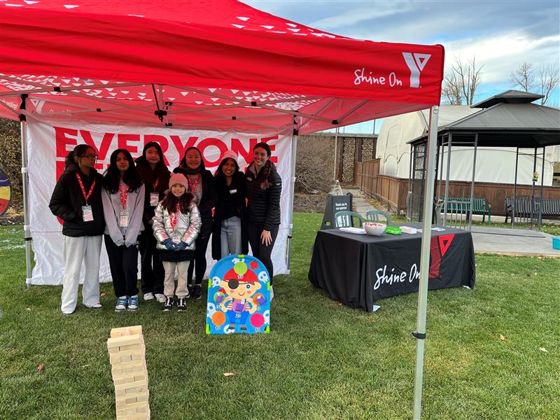 A group of youth pose at Zoo Boo in the Fall 2024