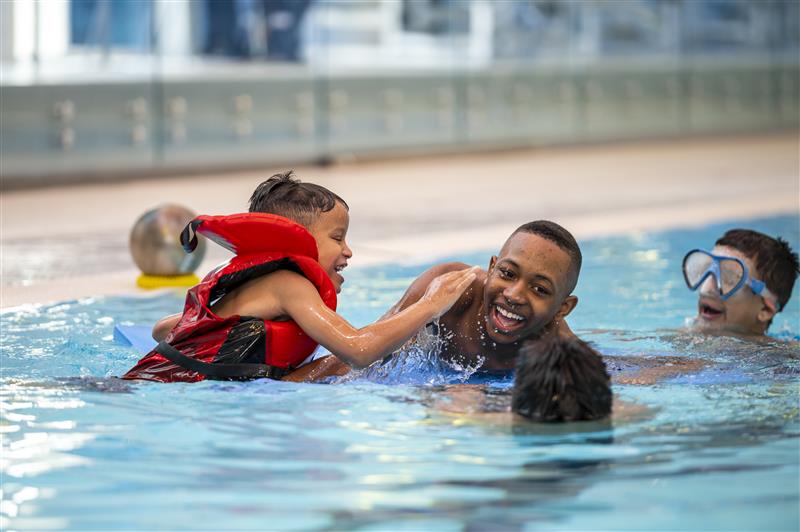 Kids swimming in a YMCA pool