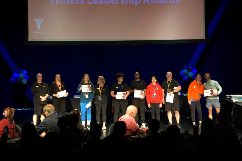 Group of people holding certificates
