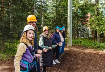 Camp chief hector staff and campers at the challeneg course