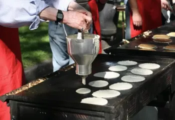 Man making pancakes at stampede breakfast
