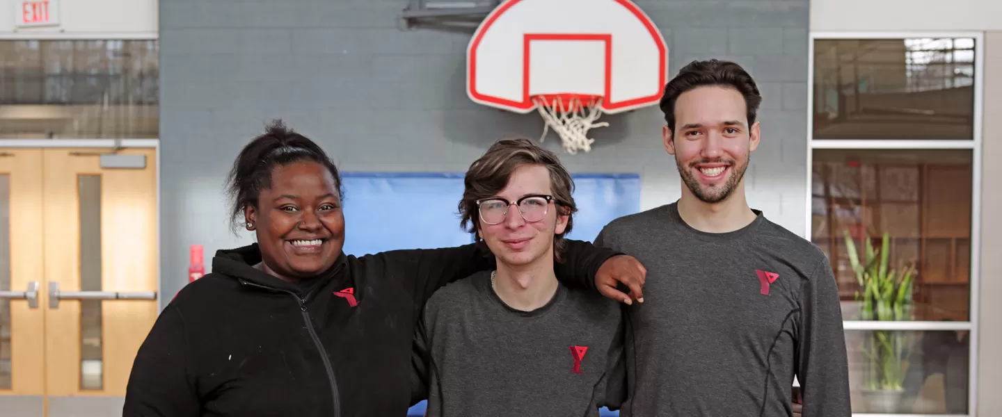 Staff in arms smiling for picture