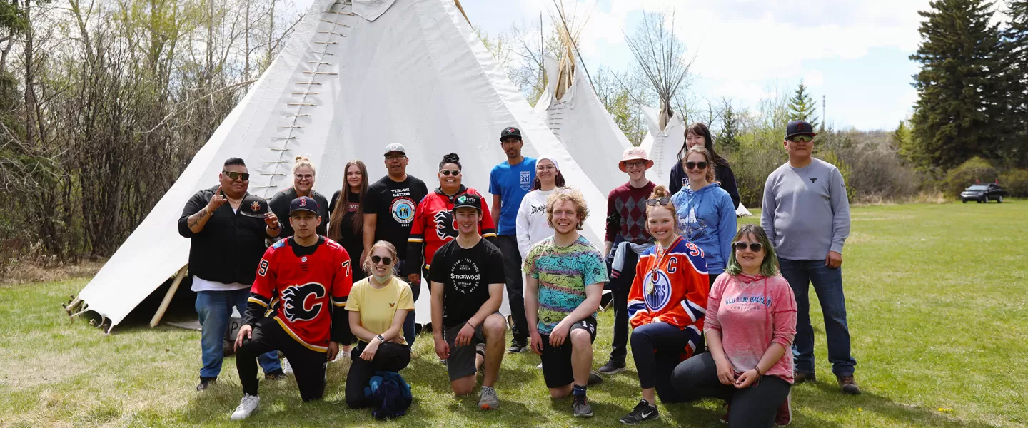 Indigenous team tipi raising