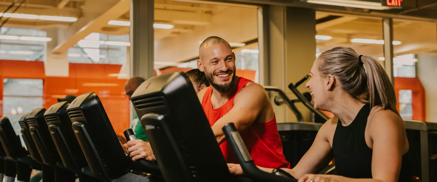 Male and female walking on the treadmill