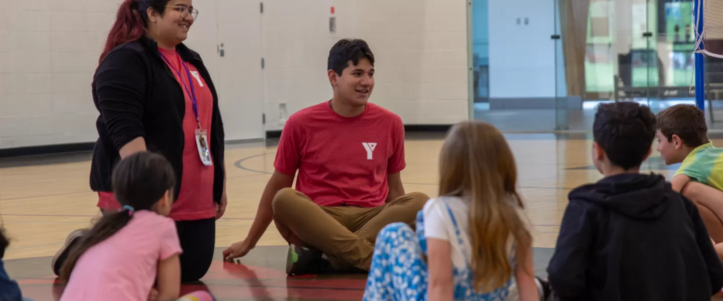 Two Day Camp Supervisor and kids in the gym