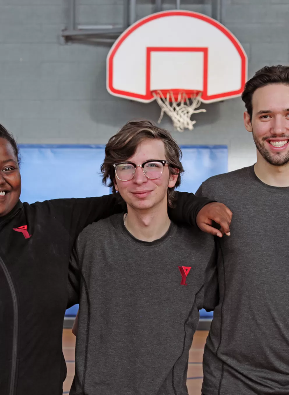 Staff in arms smiling for picture
