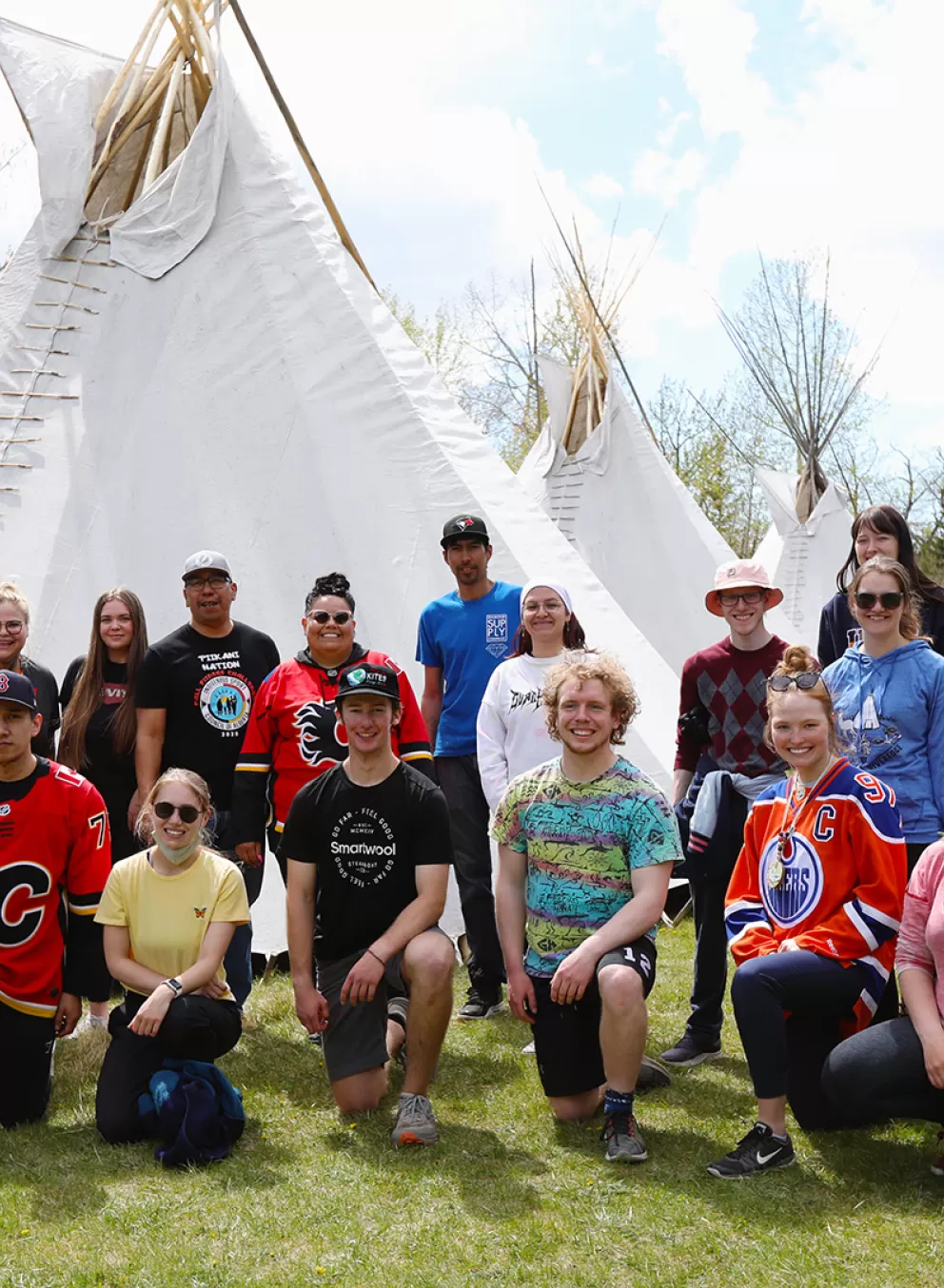 Indigenous team tipi raising