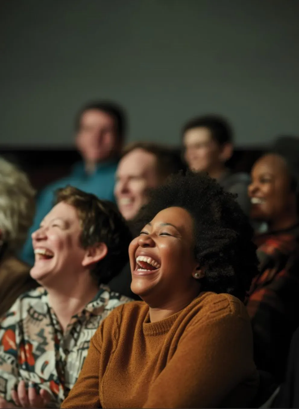 An audience of people enjoy a live performance