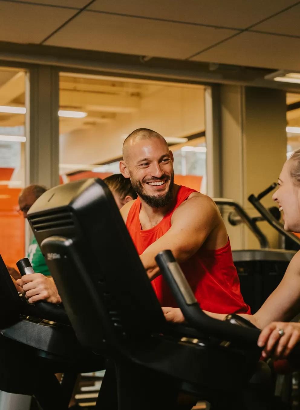 Male and female walking on the treadmill