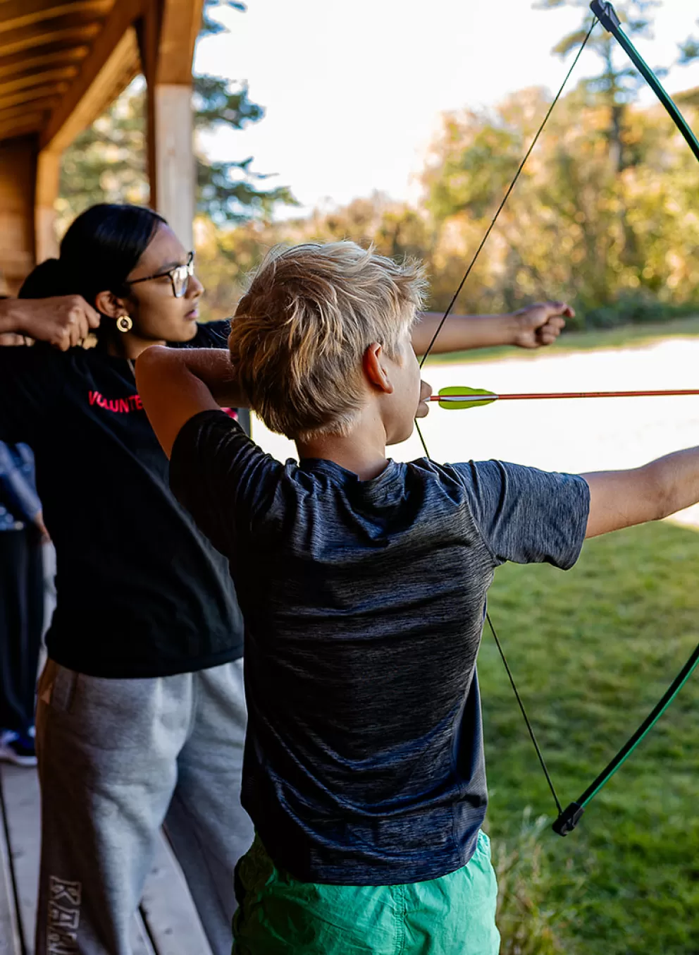 Youth shooting arrow at Camp Riveredge YMCA