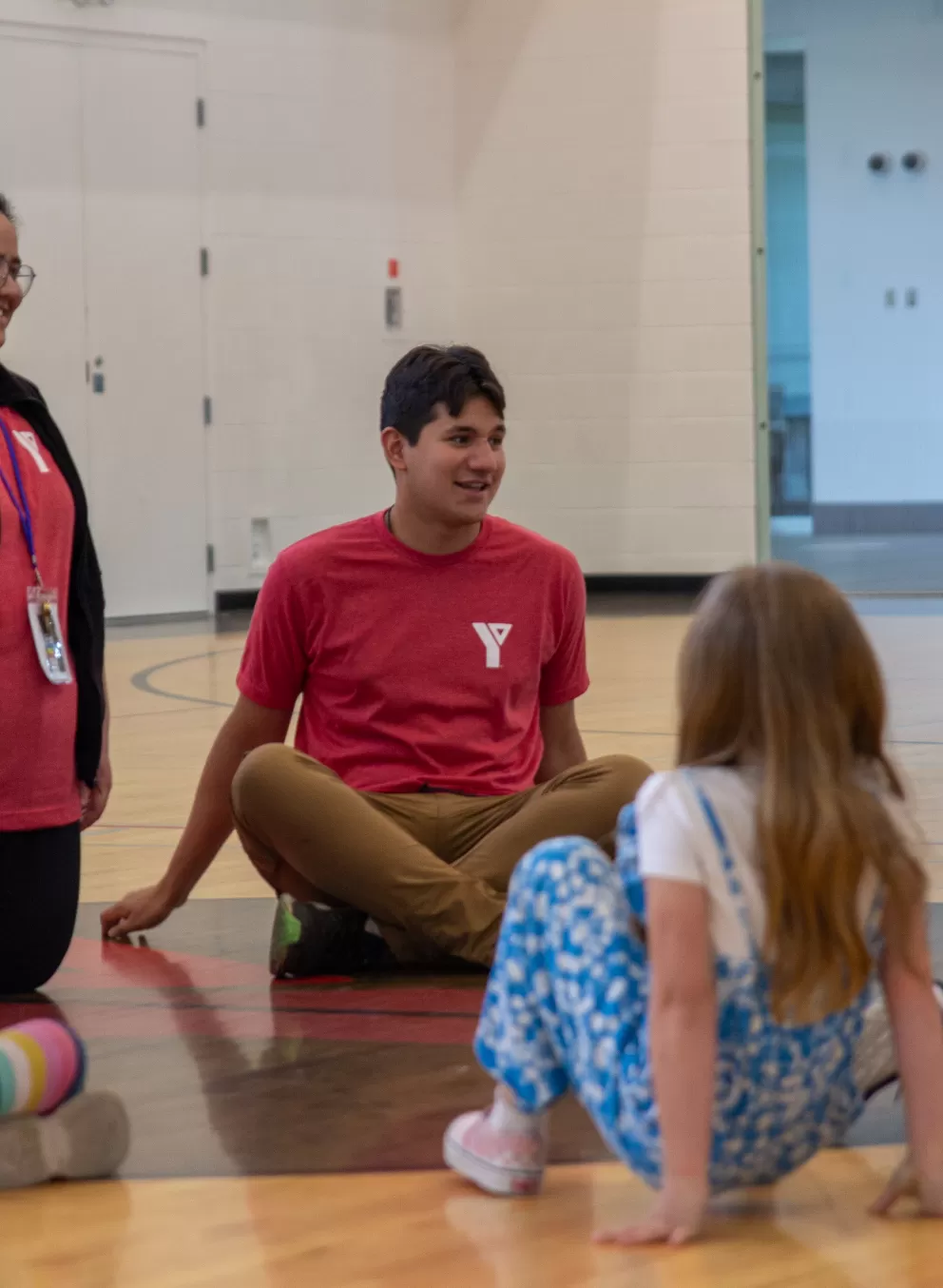 Two Day Camp Supervisor and kids in the gym