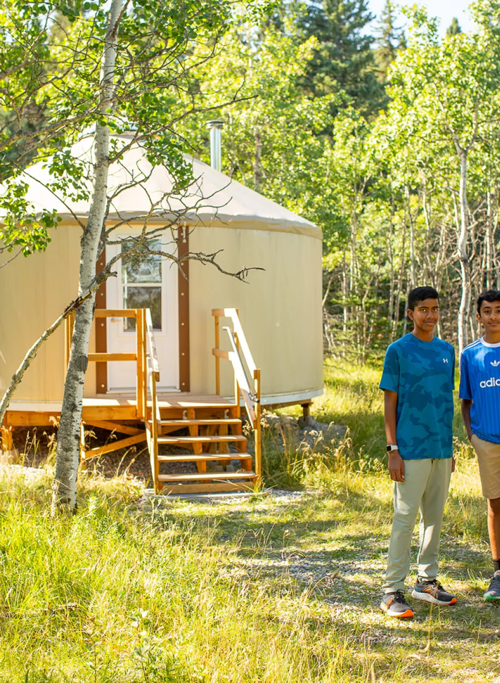 Two boys standing in fron of Yurt at Camp Chief Hector YMCA