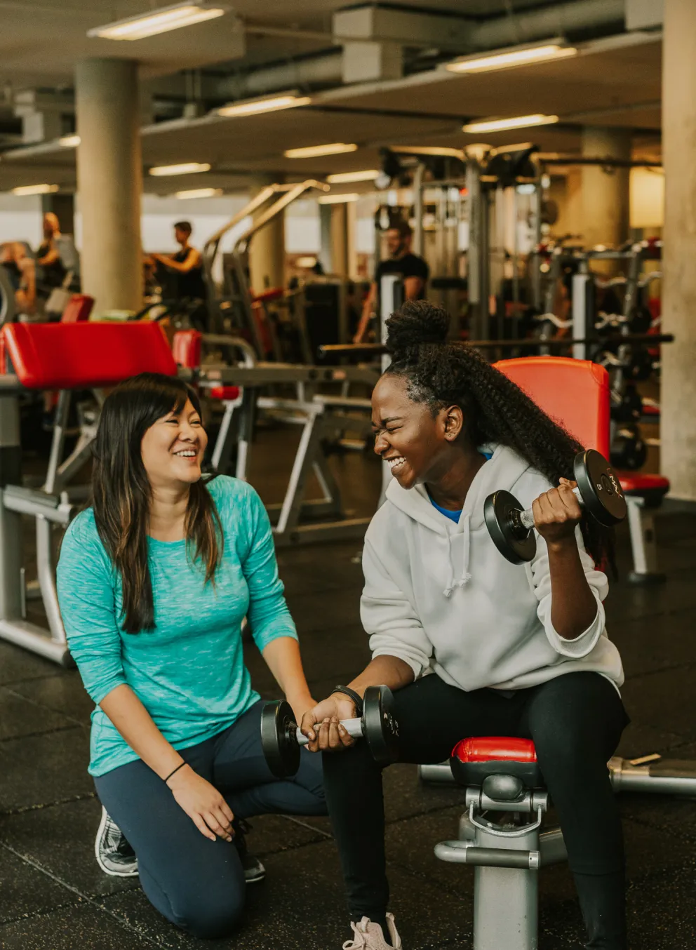 Two ladies on the weight floor