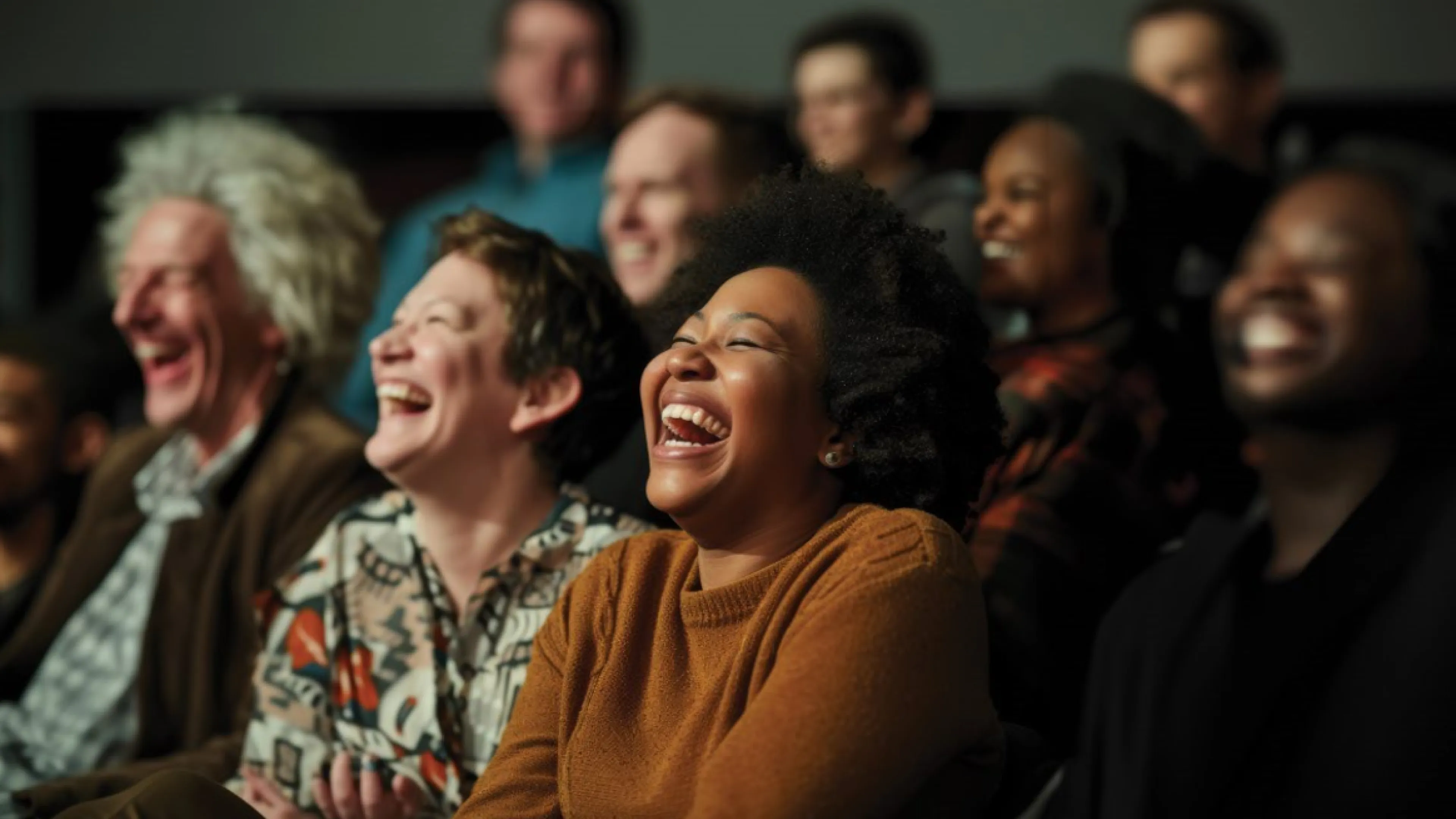 An audience of people enjoy a live performance