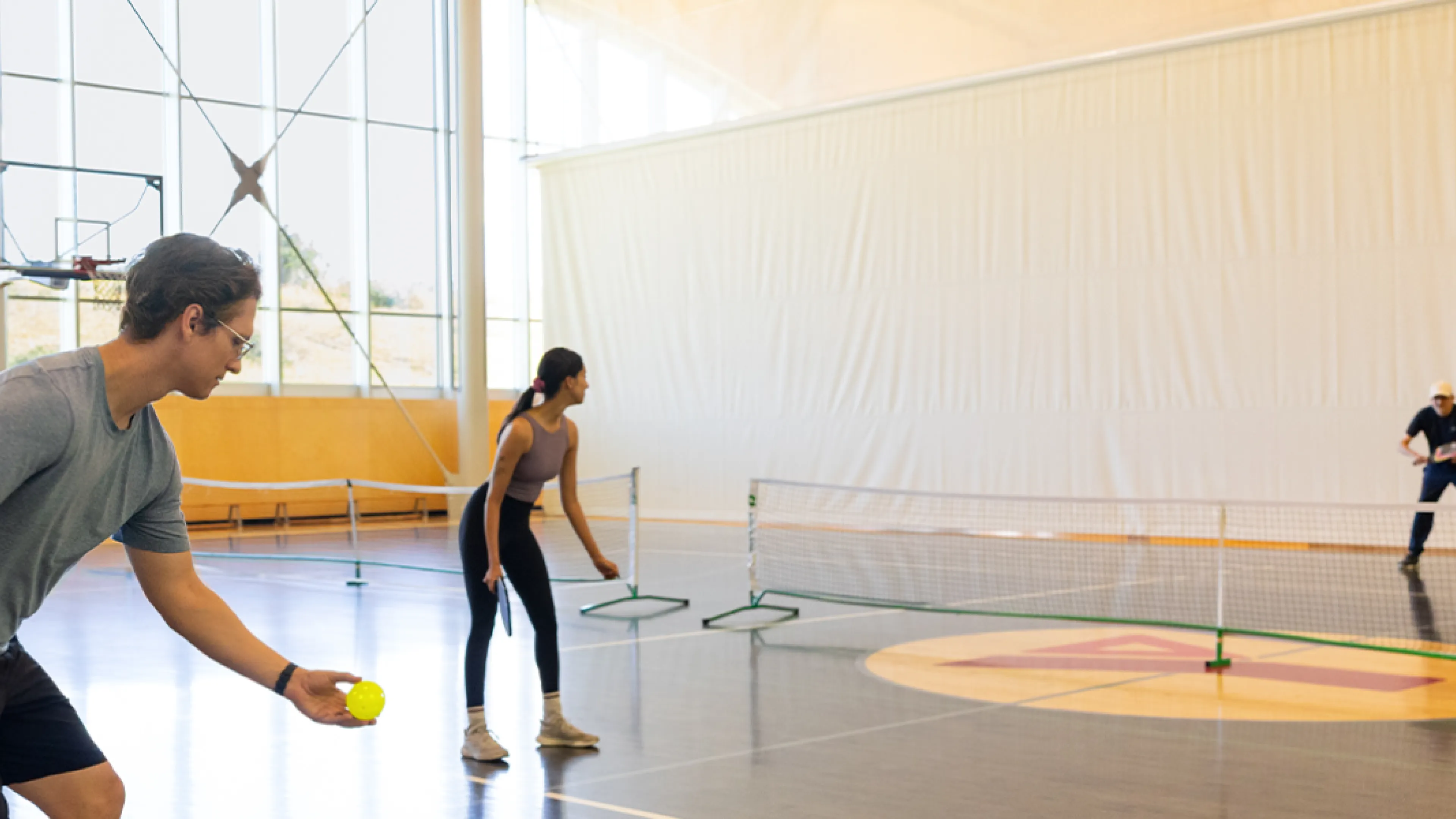 Hey Neighbour Header - YMCA Calgary members playing Pickleball