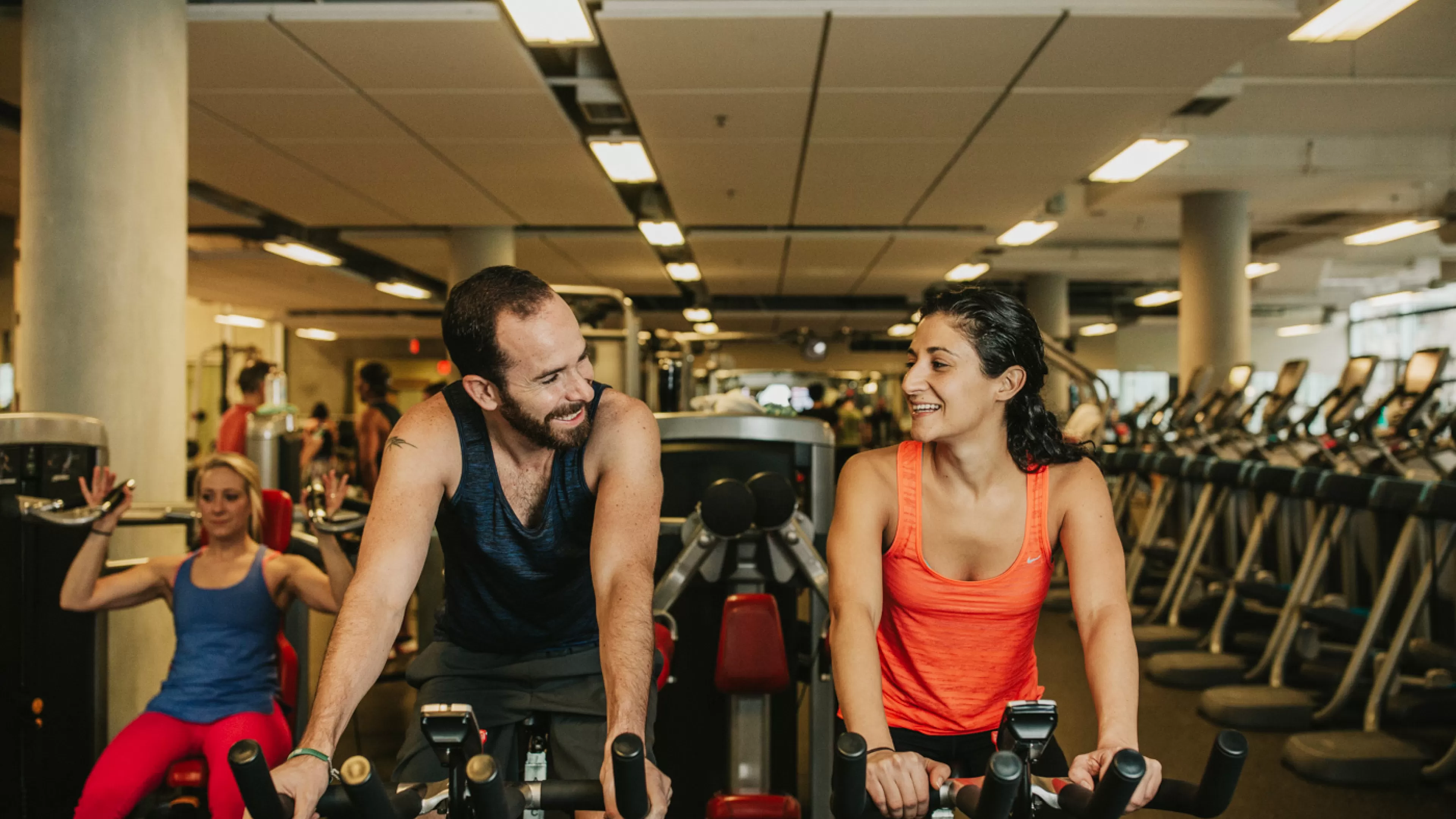 Man and woman in the weight floor at YMCA