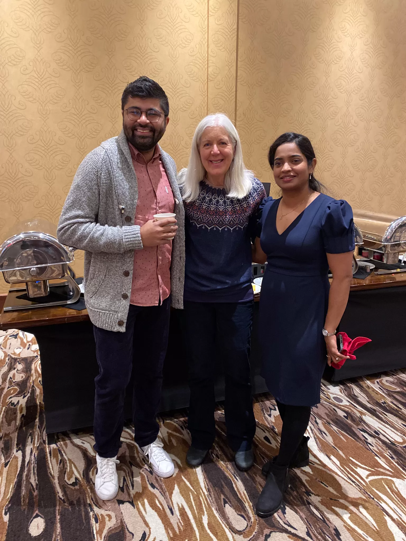 Zain Velji poses with YMCA Calgary board/staff