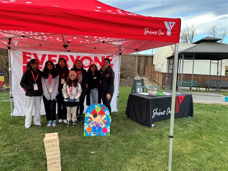 A group of youth pose at Zoo Boo in the Fall 2024