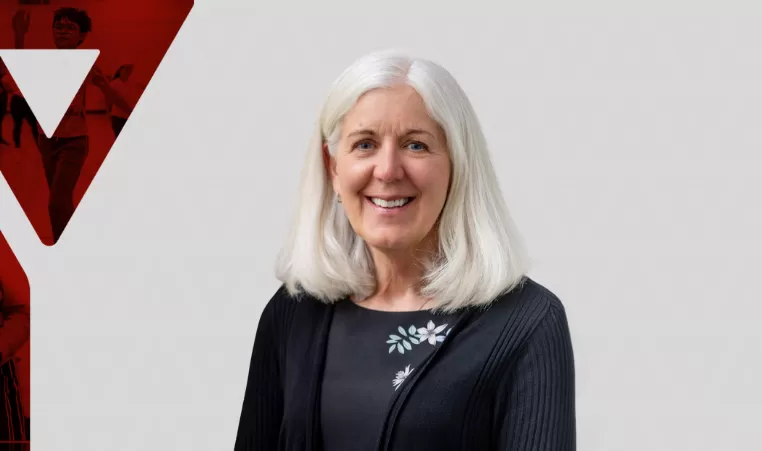 Pat White poses for a headshot on a graphic background