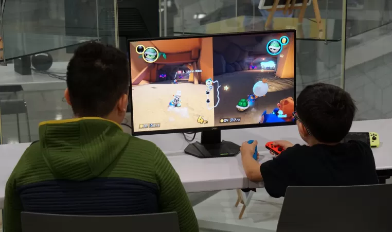 Two kids playing mario kart