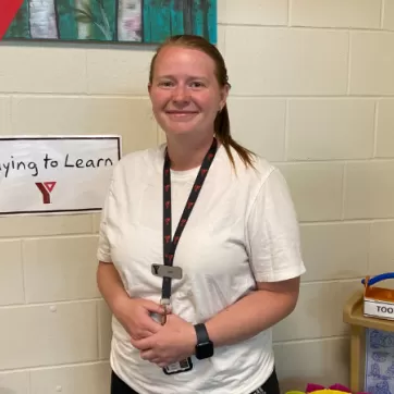 Jacy Volk poses in a childcare room 