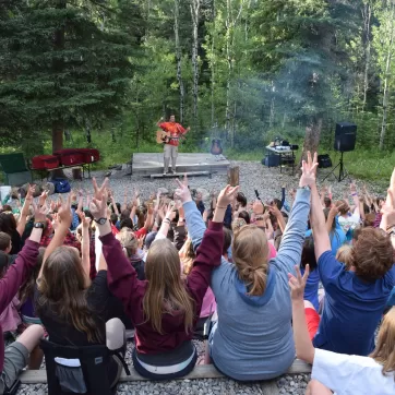 Youth enjoying at a campfire at Camp Chief Hector