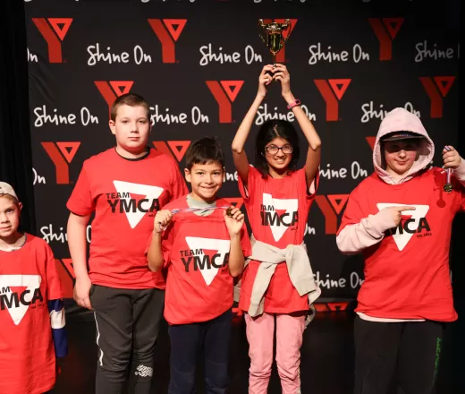 youth in front of ymca shine on background