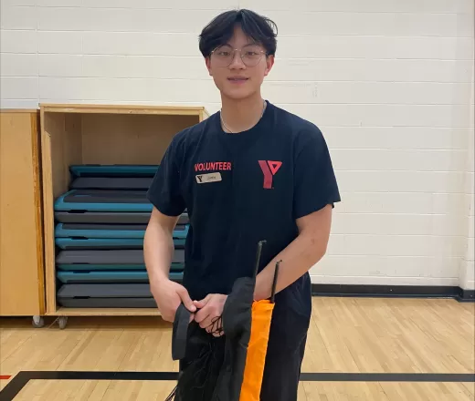 A sport volunteer at Melcor YMCA at Crowfoot