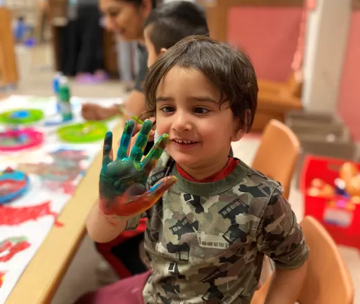 child with paint on his hand