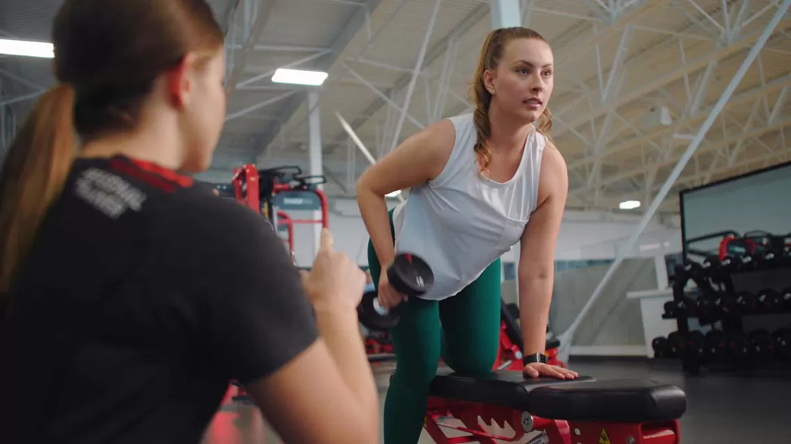 woman with personal trainer