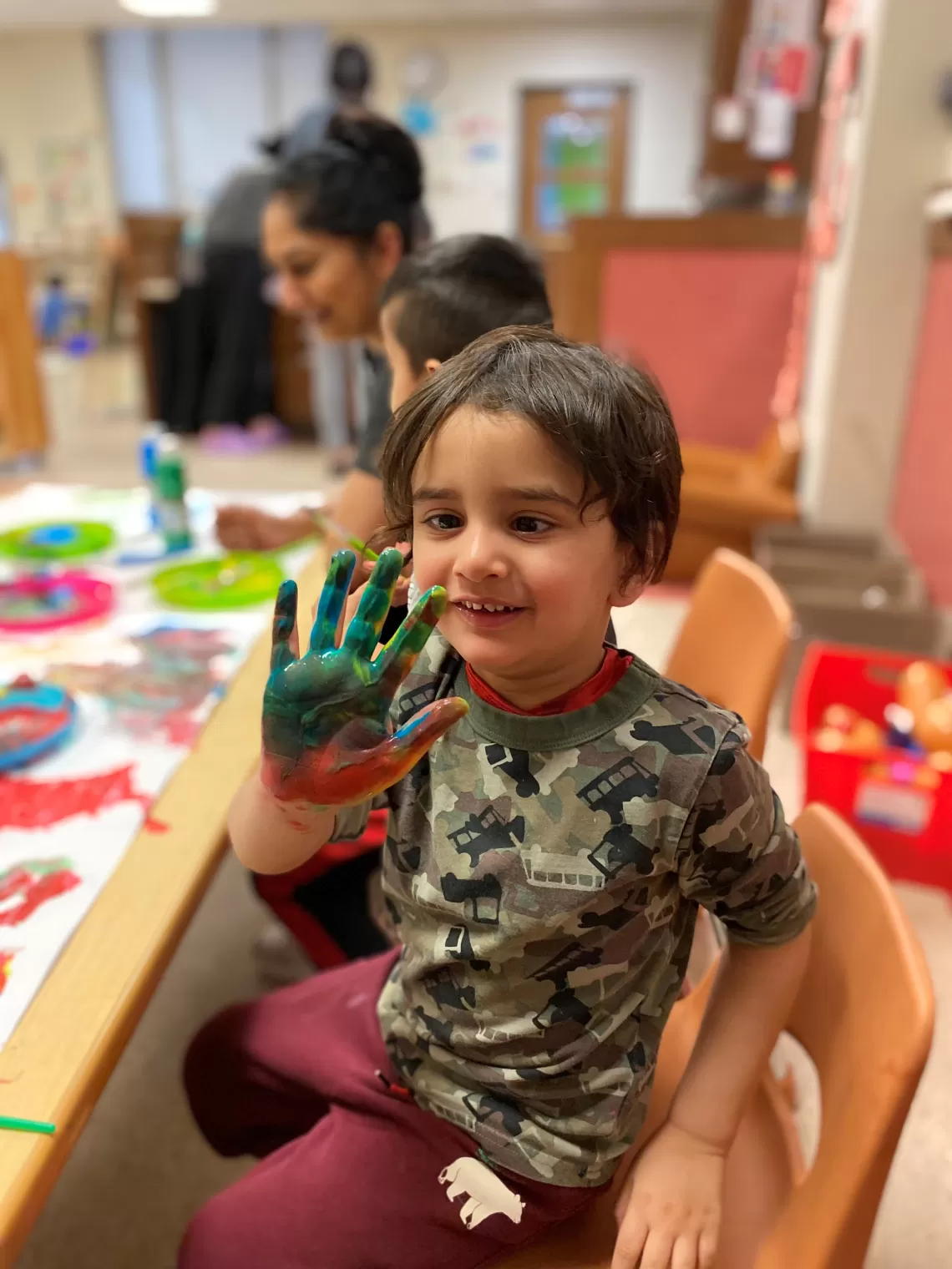 child with paint on his hand