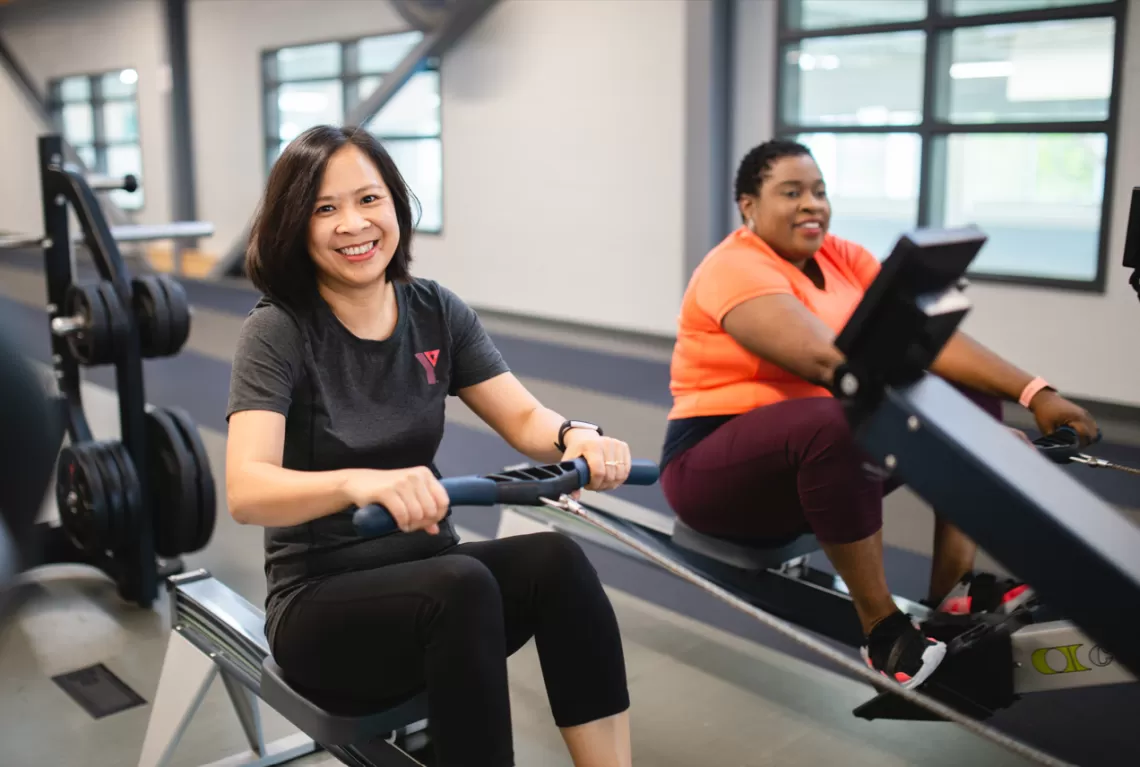 Fitness Instructor and client on strnght equipment