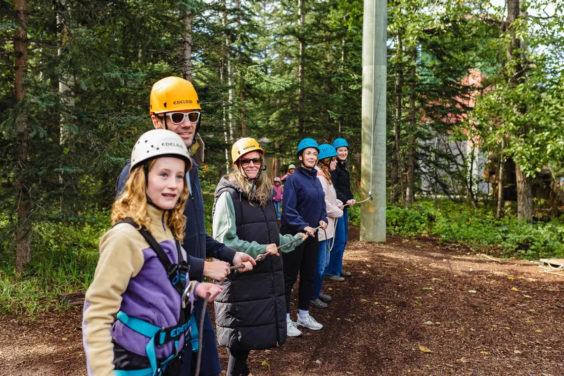 Camp chief hector staff and campers at the challeneg course