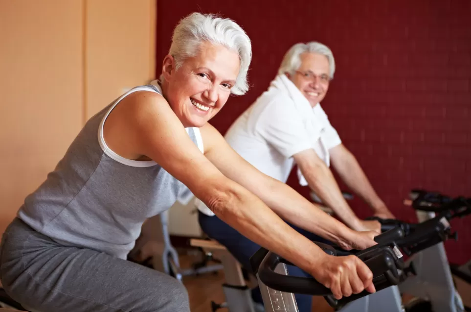 Senior woman and man working out