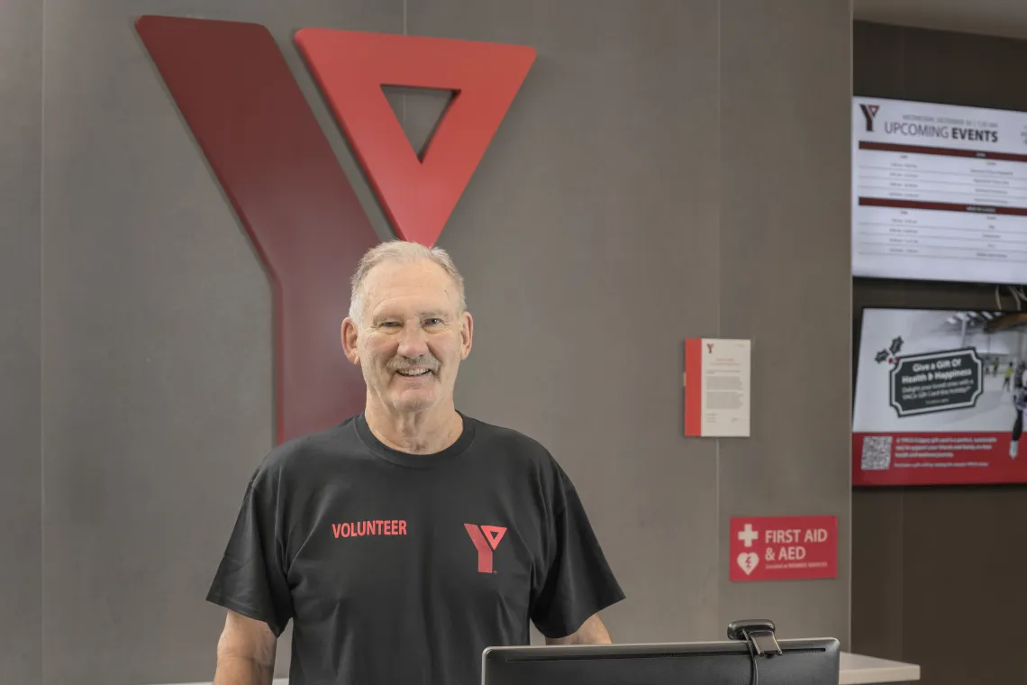 Volunteer standing in the lobby