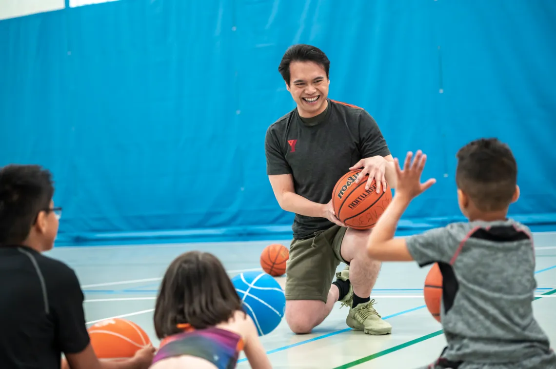 Staff with kids in the gym