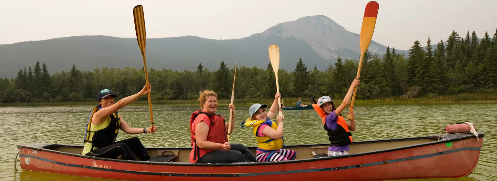 family in a canoe