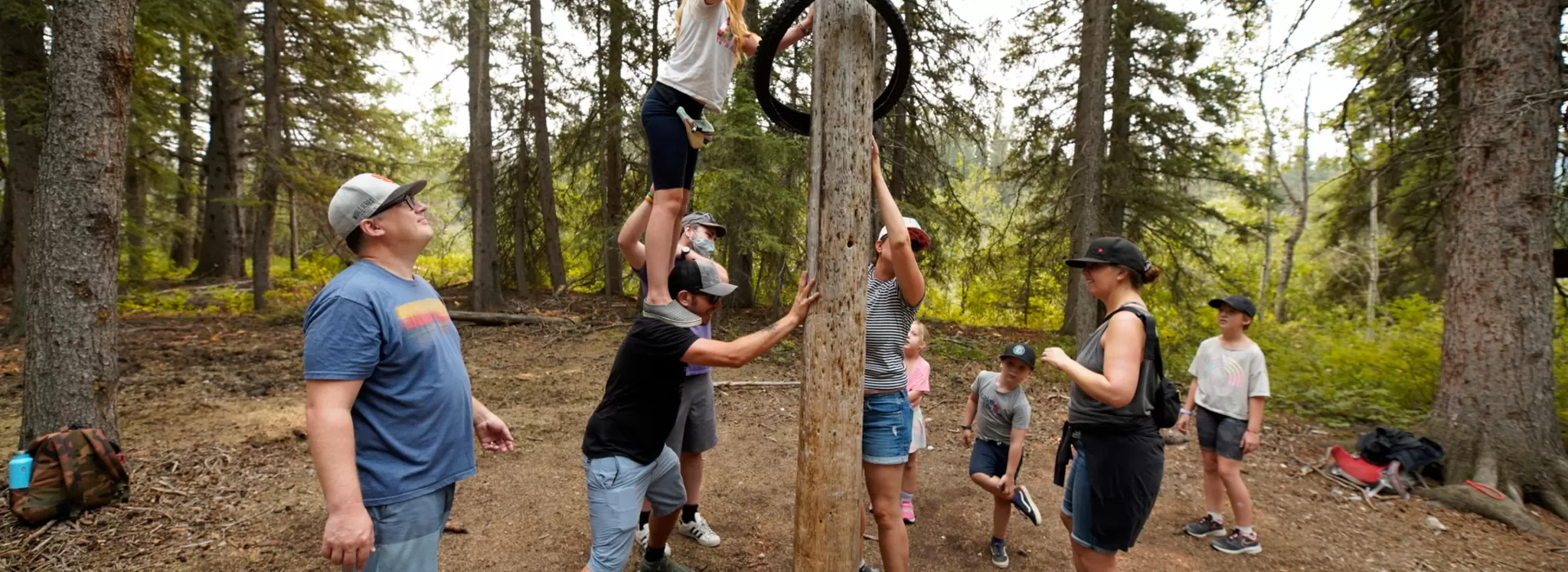 Family working on puzzle outdoors