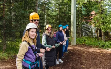 Camp chief hector staff and campers at the challeneg course
