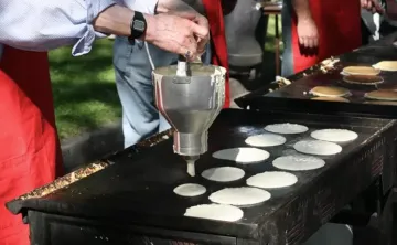 Man making pancakes at stampede breakfast